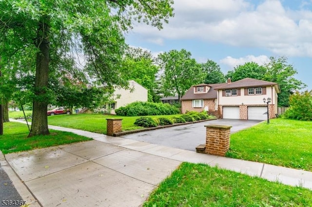 1126-1200 Grant Ave, Plainfield City, NJ 07060 - view of front of property with asphalt driveway, a garage, a front yard, and a chimney