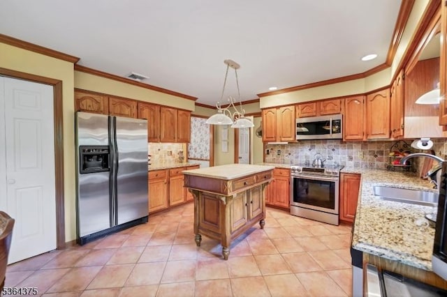 125 Drakestown Rd, Washington Twp, NJ 07853 - kitchen with appliances with stainless steel finishes, decorative backsplash, crown molding, pendant lighting, and brown cabinets