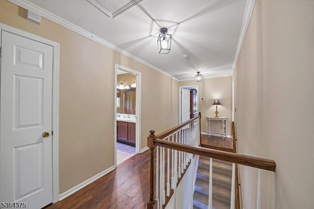 125 Drakestown Rd, Washington Twp, NJ 07853 - hallway with an upstairs landing, attic access, crown molding, and wood finished floors