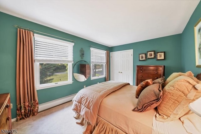 125 Drakestown Rd, Washington Twp, NJ 07853 - carpeted bedroom featuring a baseboard heating unit and a closet