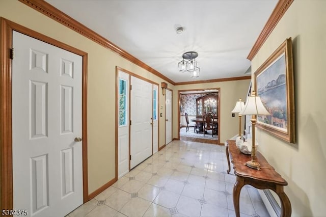 125 Drakestown Rd, Washington Twp, NJ 07853 - foyer with a chandelier, ornamental molding, and light tile patterned flooring