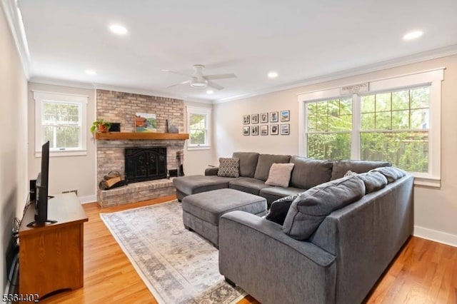 1 Deborah Dr, Morris Twp, NJ 07960 - living area with crown molding, a ceiling fan, plenty of natural light, light wood-style flooring, and a brick fireplace