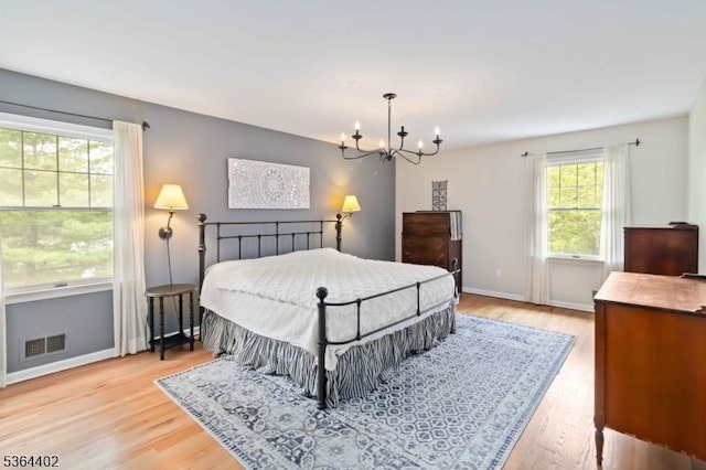 1 Deborah Dr, Morris Twp, NJ 07960 - bedroom with a chandelier and light wood-style flooring