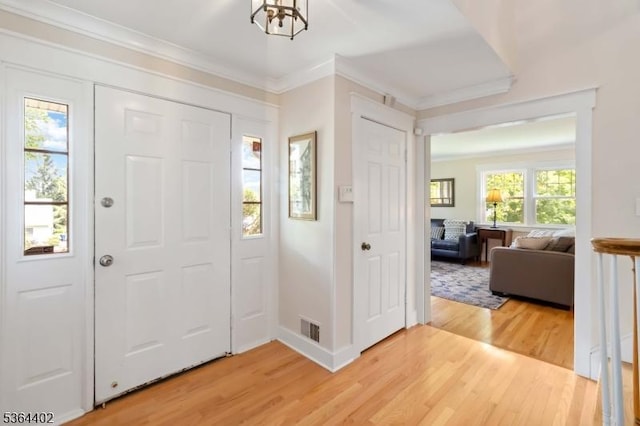 1 Deborah Dr, Morris Twp, NJ 07960 - entrance foyer with light wood-style flooring and ornamental molding