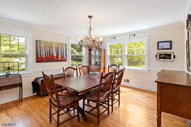 1 Deborah Dr, Morris Twp, NJ 07960 - dining area featuring crown molding, plenty of natural light, light wood-style flooring, and a chandelier