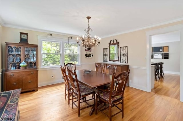 1 Deborah Dr, Morris Twp, NJ 07960 - dining area with light wood finished floors, a chandelier, and crown molding