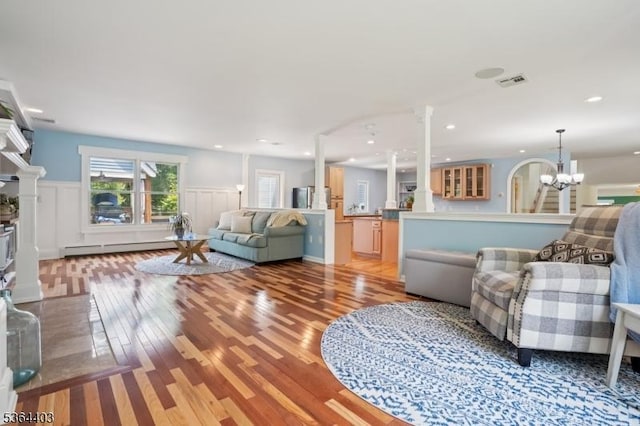 18 Forest Trl, Bernards Twp, NJ 07920 - living area featuring light wood-style floors, decorative columns, a chandelier, wainscoting, and recessed lighting