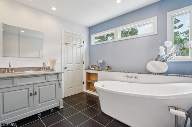 18 Forest Trl, Bernards Twp, NJ 07920 - bathroom with double vanity, a freestanding tub, tile patterned floors, and recessed lighting