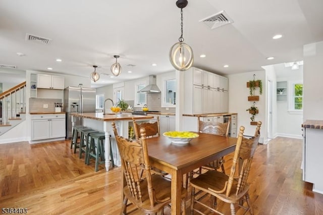 18 Forest Trl, Bernards Twp, NJ 07920 - dining room with light wood-style flooring, recessed lighting, stairs, and healthy amount of natural light