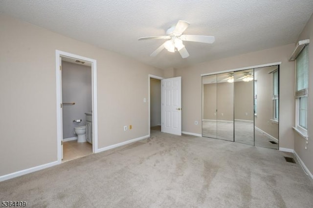 1505 Doolittle Dr, Bridgewater Twp, NJ 08807 - unfurnished bedroom with carpet, a closet, ensuite bath, a textured ceiling, and ceiling fan