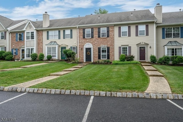 1505 Doolittle Dr, Bridgewater Twp, NJ 08807 - multi unit property featuring a chimney, a front lawn, brick siding, and uncovered parking