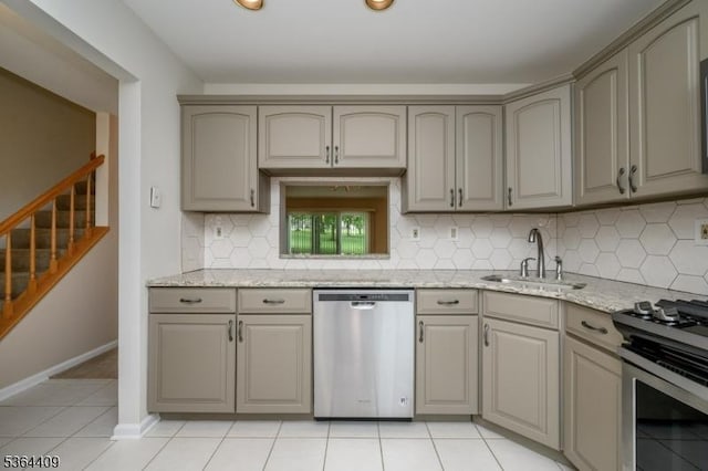1505 Doolittle Dr, Bridgewater Twp, NJ 08807 - kitchen with appliances with stainless steel finishes, decorative backsplash, gray cabinetry, and light stone countertops