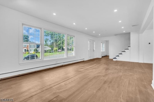 71 Tiffany Dr, East Hanover Twp, NJ 07936 - unfurnished living room with stairs, baseboard heating, recessed lighting, and light wood-style floors