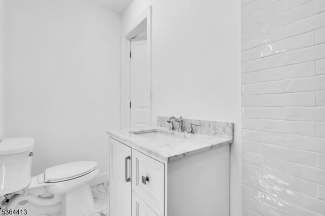 71 Tiffany Dr, East Hanover Twp, NJ 07936 - bathroom featuring marble look tiles and vanity