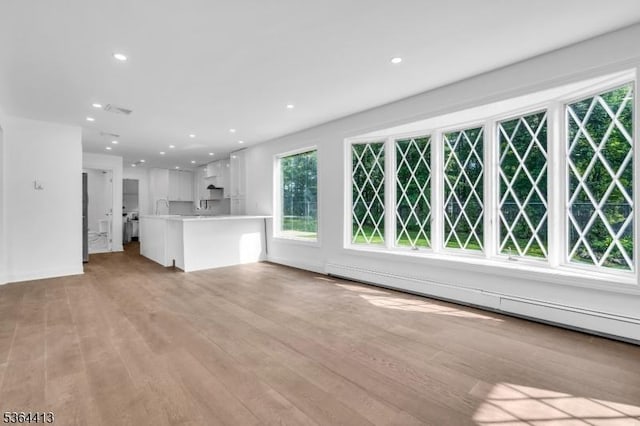 71 Tiffany Dr, East Hanover Twp, NJ 07936 - unfurnished living room featuring light wood-style floors and recessed lighting