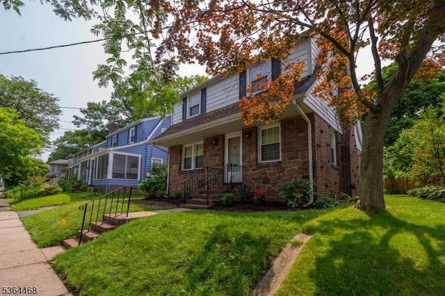 28 Overlook Ter, Maplewood Twp, NJ 07040 - view of front of home with stone siding and a front yard