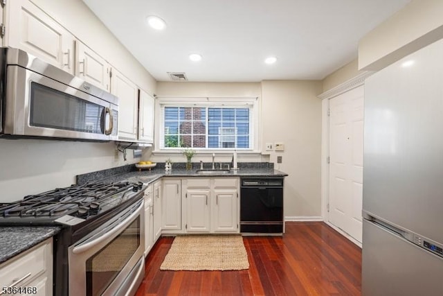 28 Overlook Ter, Maplewood Twp, NJ 07040 - kitchen featuring appliances with stainless steel finishes, dark countertops, white cabinets, dark wood-type flooring, and recessed lighting