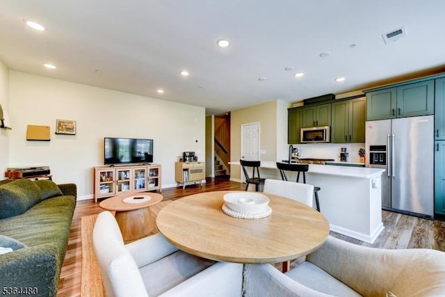 1005 Station Rd, Somerville Boro, NJ 08876 - dining area with stairway, light wood-type flooring, and recessed lighting