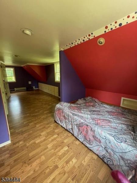 250 Waconia Rd, Vernon Twp, NJ 07422 - bedroom featuring wood finished floors and vaulted ceiling