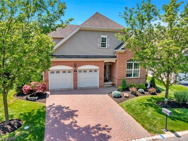 138 Canal Walk Blvd, Franklin Twp, NJ 08873 - traditional home featuring a front lawn, decorative driveway, brick siding, and roof with shingles