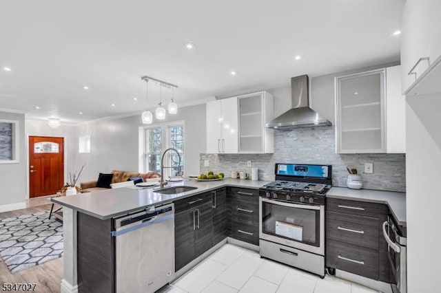 1218 Kline Pl, Rahway City, NJ 07065 - kitchen with appliances with stainless steel finishes, wall chimney range hood, light countertops, white cabinets, and recessed lighting