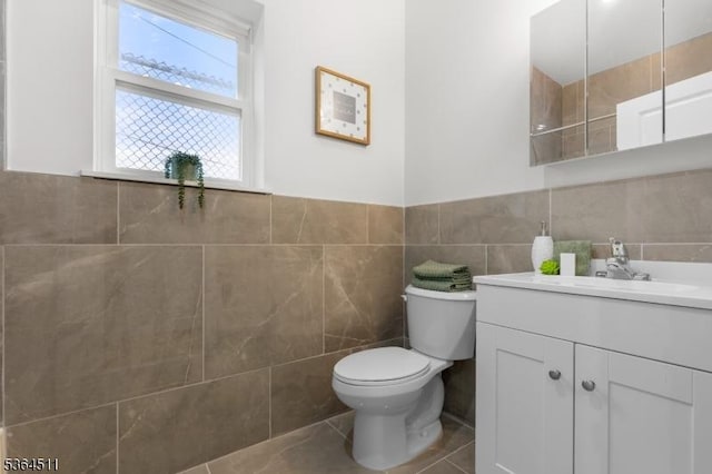 22 Speedway Ave, Newark City, NJ 07106 - bathroom with tile walls, vanity, tile patterned flooring, and wainscoting