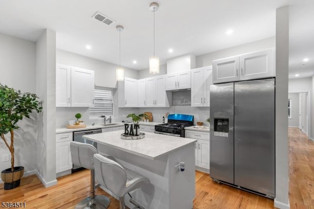 22 Speedway Ave, Newark City, NJ 07106 - kitchen with stainless steel appliances, light countertops, light wood finished floors, a center island, and recessed lighting