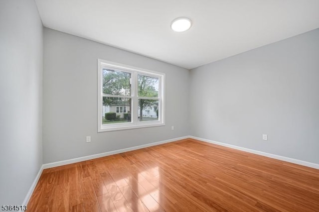 125 Birch St, Bloomfield Twp, NJ 07003 - spare room featuring baseboards and light wood-style floors