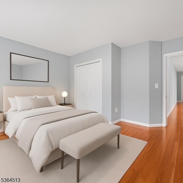 125 Birch St, Bloomfield Twp, NJ 07003 - bedroom featuring light wood-style flooring and a closet