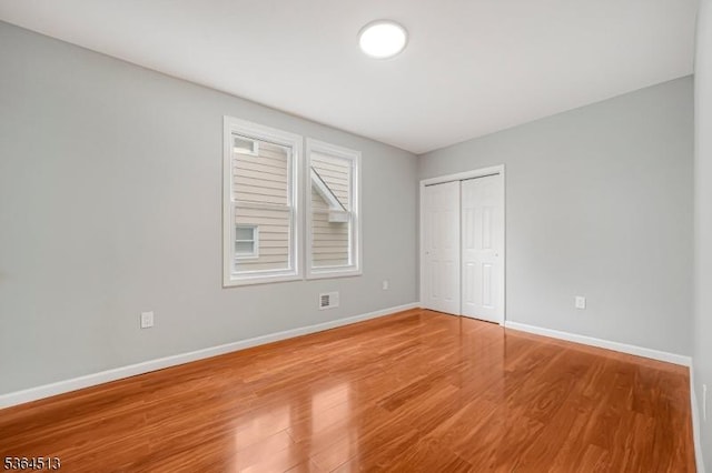 125 Birch St, Bloomfield Twp, NJ 07003 - unfurnished bedroom with wood finished floors and a closet
