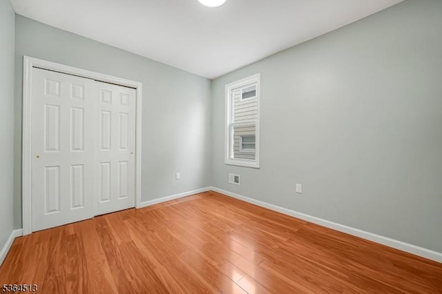 125 Birch St, Bloomfield Twp, NJ 07003 - unfurnished bedroom with light wood-style flooring and a closet