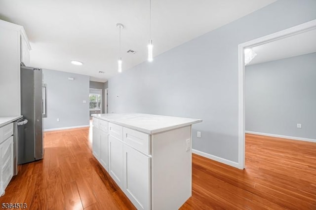 125 Birch St, Bloomfield Twp, NJ 07003 - kitchen featuring stainless steel appliances, a center island, light wood-style flooring, white cabinetry, and recessed lighting
