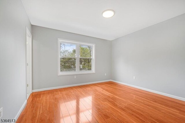 125 Birch St, Bloomfield Twp, NJ 07003 - spare room featuring light wood-style floors and baseboards
