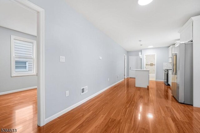 125 Birch St, Bloomfield Twp, NJ 07003 - unfurnished living room with light wood-style floors