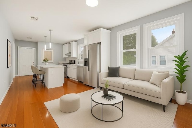 125 Birch St, Bloomfield Twp, NJ 07003 - living room featuring dark wood-style floors and baseboards