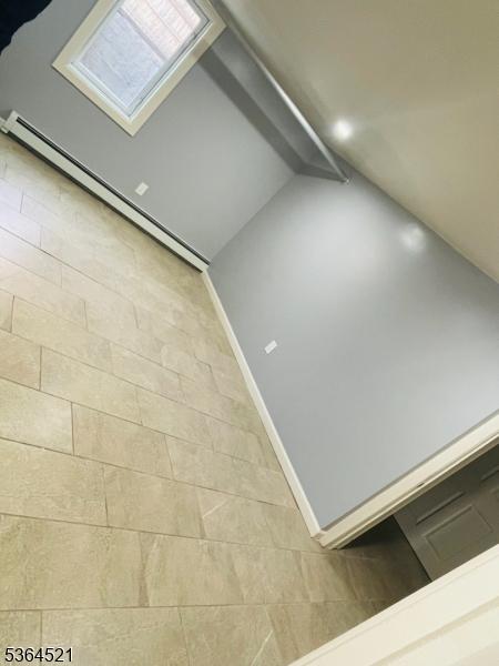 226 N 3rd Ave, Manville Boro, NJ 08835 - detailed view of baseboard heating and baseboards