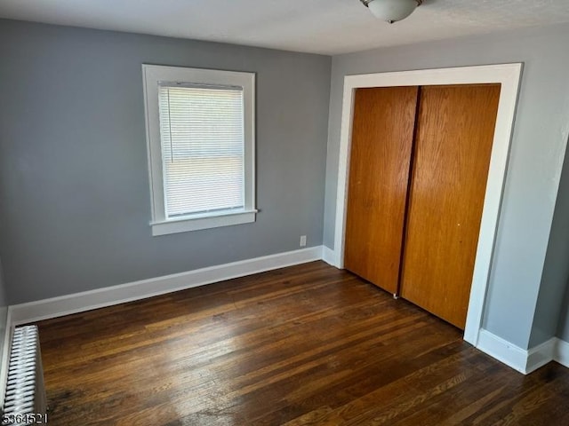 226 N 3rd Ave, Manville Boro, NJ 08835 - unfurnished bedroom with a closet and dark wood-type flooring