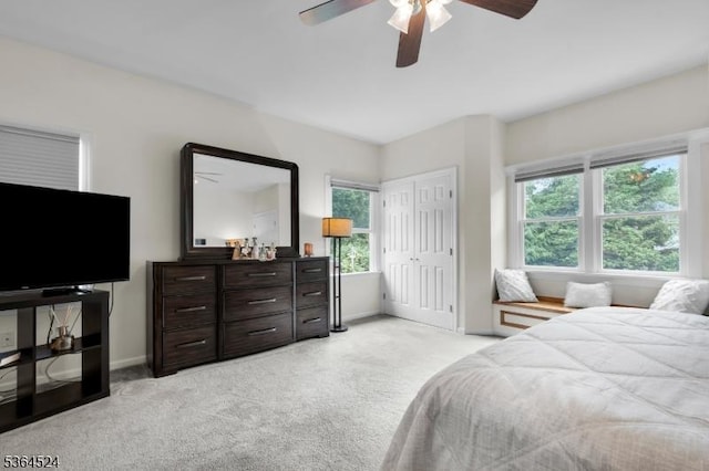 32 Sanford Dr, Randolph Twp, NJ 07869 - bedroom with light colored carpet, a ceiling fan, and a closet