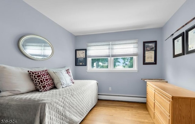 32 Sanford Dr, Randolph Twp, NJ 07869 - bedroom featuring baseboard heating and light wood finished floors