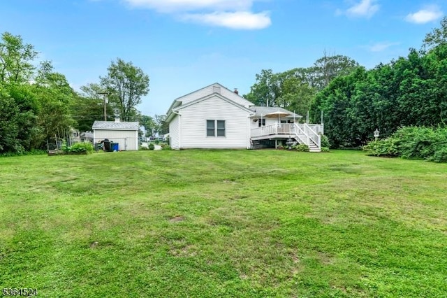 32 Sanford Dr, Randolph Twp, NJ 07869 - back of property featuring a deck and a lawn