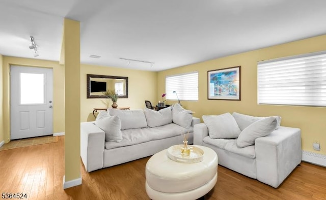 32 Sanford Dr, Randolph Twp, NJ 07869 - living room with rail lighting and wood finished floors