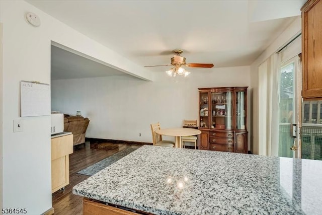312 Cheyenne Rd Unit 312, Andover Twp, NJ 07848 - kitchen featuring a ceiling fan, dark wood finished floors, light stone countertops, and beam ceiling