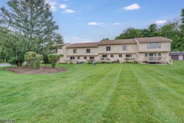 312 Cheyenne Rd Unit 312, Andover Twp, NJ 07848 - rear view of house featuring a lawn and a deck