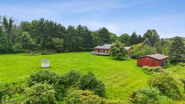 84 Liberty Corner Rd, Warren Twp, NJ 07059 - view of green lawn with a forest view and an outdoor structure