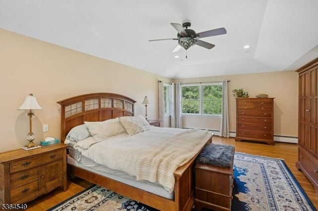 5 Woodland Rd, Franklin Twp, NJ 08867 - bedroom featuring light wood-type flooring, recessed lighting, a baseboard heating unit, ceiling fan, and a raised ceiling
