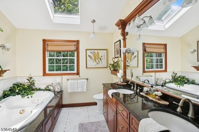 5 Woodland Rd, Franklin Twp, NJ 08867 - bathroom with a skylight, tile patterned flooring, a tub with jets, and double vanity