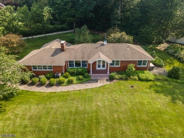 5 Woodland Rd, Franklin Twp, NJ 08867 - view of front of property with a front yard and a chimney