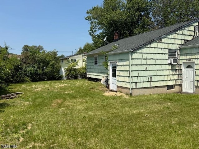 397 Lake Ave, Woodbridge Twp, NJ 07067 - view of side of property with a lawn and roof with shingles
