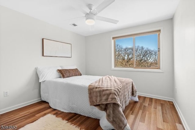 32 Mineral Spring Ave, Passaic City, NJ 07055 - bedroom featuring wood finished floors and a ceiling fan