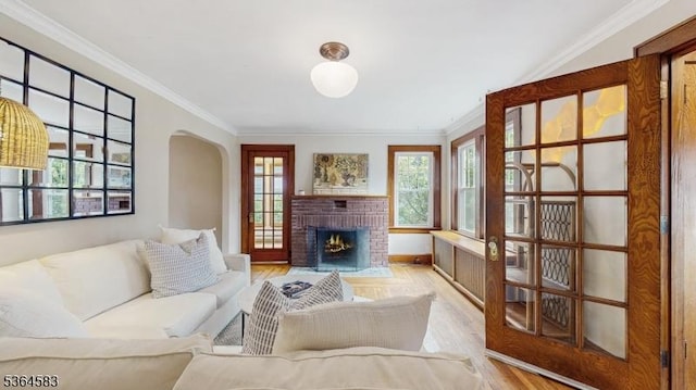 18 Lasalle Ave, Cranford Twp, NJ 07016 - living room with wood finished floors, ornamental molding, arched walkways, and a brick fireplace